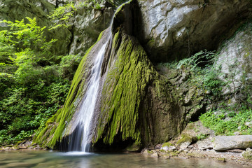 Beautiful waterfall falling from a rock covered by moss. Kot waterfall, San Leonardo village close to Cividale del Friuli, Udine province, Friuli Venezia Giulia region, Italy. © Marco