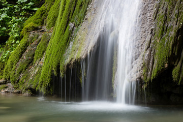 Beautiful waterfall falling from a rock covered by moss. Kot waterfall, San Leonardo village close to Cividale del Friuli, Udine province, Friuli Venezia Giulia region, Italy. © Marco