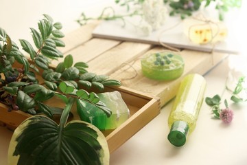 Natural soap,  plants and berries on a wooden table, spa procedures, body care, healthy lifestyle