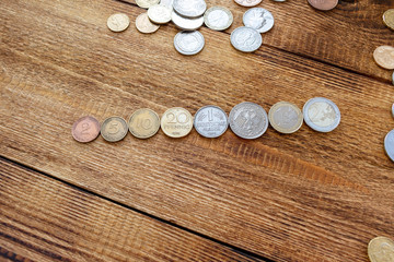 Fototapeta na wymiar coins old euro replaced by new Europe euro pile pack heap on a wooden background mock up selective focus close up