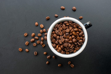 coffee bean in cup on black background