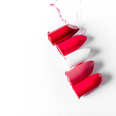 Cutted lipstick close-up isolated on white background