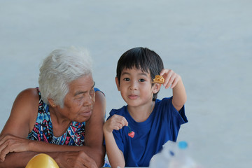 grandmother and a boy playing