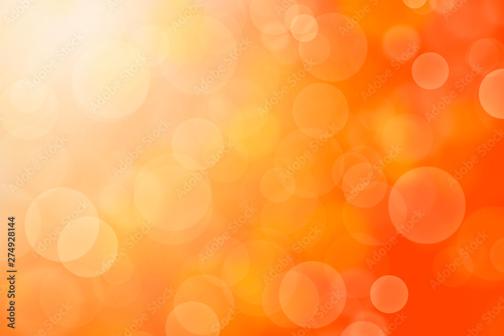 Wall mural orange abstract background blur with bokeh light effect.