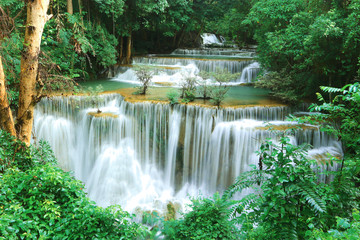 Huai Mae Khamin Waterfall, Kanchanaburi Province, Thailand With water and lush green trees.