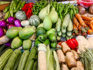 A counter with fresh vegetables in the Chinese market