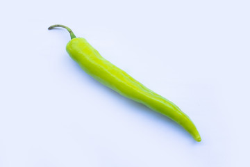 A green chilli on white background