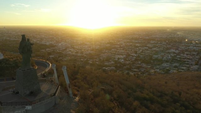 Aerial Drone Sunset View over Cerro de la Memoria and the Virgin in Los Mochis, Sinaloa, Mexico