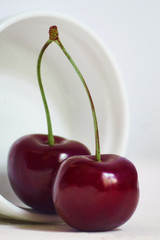 close up  cherry on white concrete background with copy space
