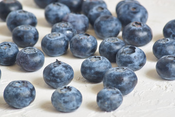 close up of  blueberries on white concrete background