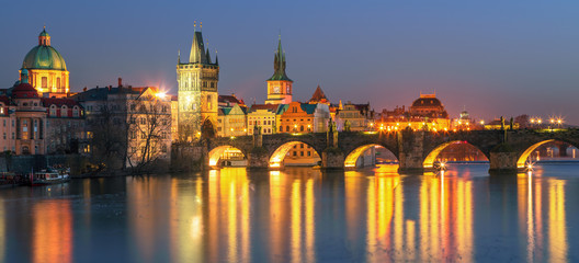 Fototapeta na wymiar Sunset view on Prague old town and iconic Charles bridge on Vltava river, Czech Republic