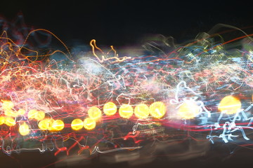 Abstract blur image of Night light bokeh on street for background usage. (vintage tone)