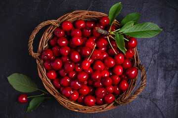 Cherries - berries on black background. Summer fruits. Food background, layout