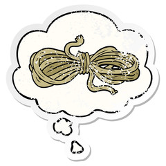 cartoon rope and thought bubble as a distressed worn sticker