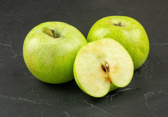 Green apple with half