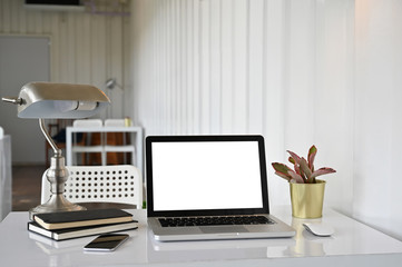 Mockup laptop and notebook on office desk.