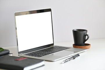 Mockup laptop computer on working space.