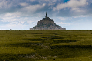 Mont St. Michel church near by the sea in Northern of France during cloudy.