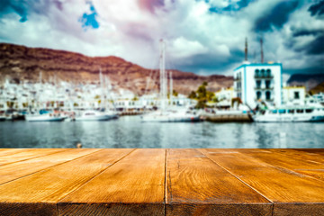 desk of free space and summer background of beach 