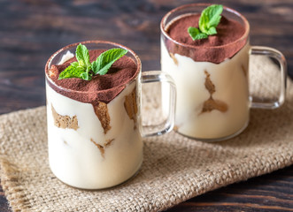 Two glass mugs of tiramisu