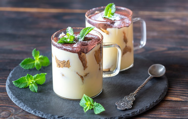 Two glass mugs of tiramisu