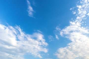 Textured sky feather clouds on blue
