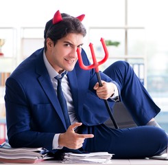 Devil angry businessman in the office