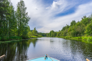 Picturesque summer landscape with northern river and forest in summer cloudy day. Travelling and...