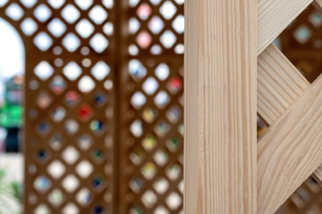 Old wooden lattice background. Partition wooden texture. Wooden arbor pavilion with lattice