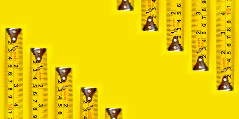 Yellow measurFrame yellow measuring tape on yellow background and texture.ing tape on yellow background.
