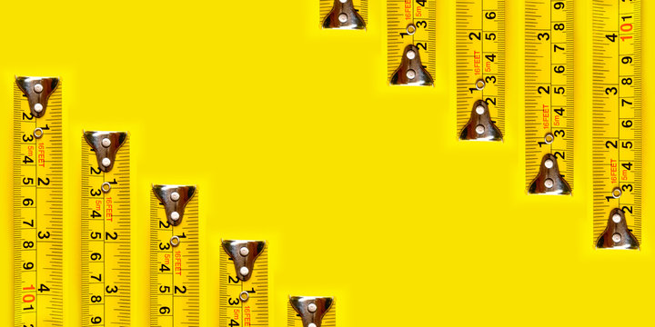 Yellow measurFrame yellow measuring tape on yellow background and texture.ing tape on yellow background.
