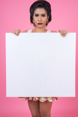 Portrait of fashion woman displaying white banner