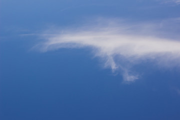 simple background nature scenic photography of blue sky and one white cloud, copy space 