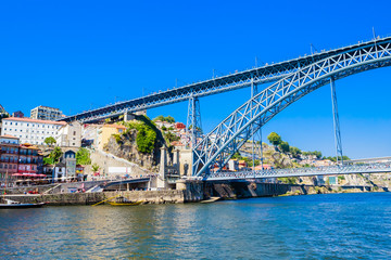 Fototapeta premium Famous steel bridge dom Luis above connects Old town Porto with Vila Nova de Gaia at river Douro, Portugal.