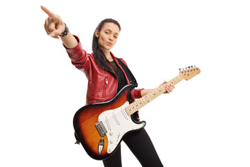 Young female musician with a bass electric guitar - obrazy, fototapety, plakaty