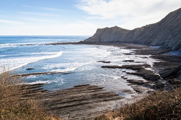 Geological rock formations and cliffs on the Flysch route. Cantabrian Sea. In Vizcaya, Basque Country. Spain