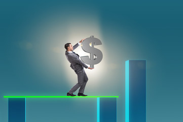 Young businessman in business concept with bar charts