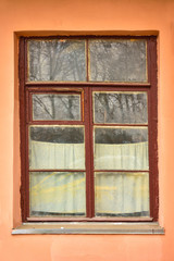 wooden window with brown frame in window