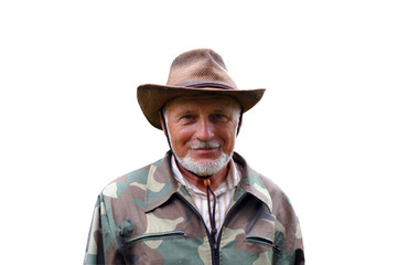 Fototapeta premium Middle aged traveler. Portrait of a handsome adult man with a gray beard and hat in camouflage clothing.