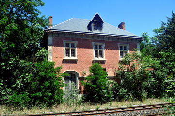 Abandoned train station with old red brick architecture