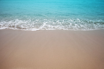 Fototapeta na wymiar Sand and sea wave. Beach nature background.