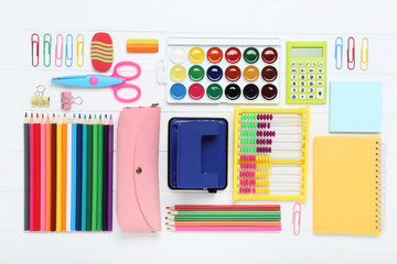 School supplies on white wooden table