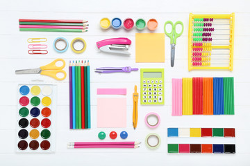 School supplies on white wooden table