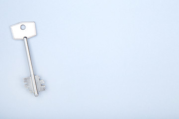 House key on grey background
