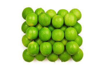 Many fresh limes on white background.