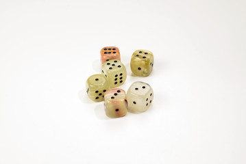Dices made of natural stone on a white background. Copy space. Gaming.