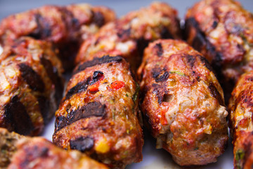 Close up of grilled meat cevapcici balls