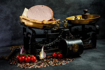 big piece of delicatessen boiled sausage on craft paper