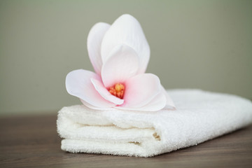 Obraz na płótnie Canvas Spa orchid with soft towels on wooden table