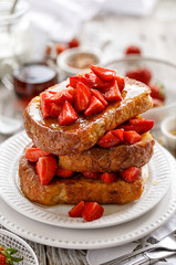 French toasts, French toasts made of sliced brioche with fresh strawberries and honey.  Delicious breakfast or dessert
